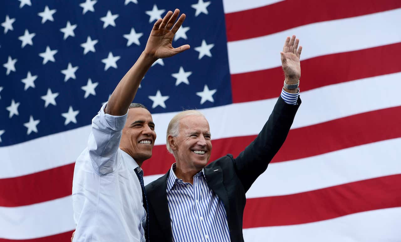 Barack Obama and Joe Biden wave to supporters during a campaign rally in September 2012.