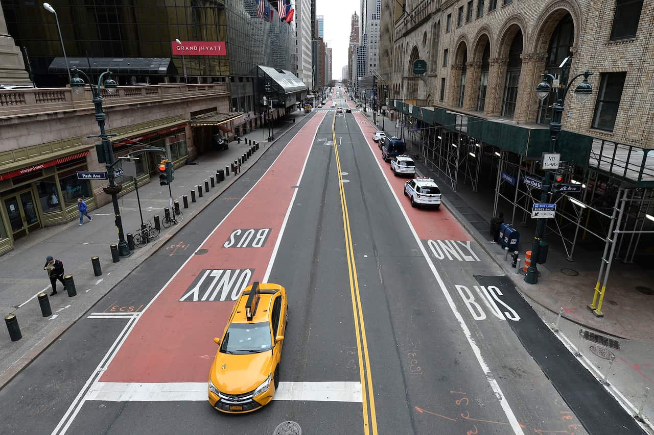 A single taxi makes its way up 42nd Street, New York, NY, 12 April, 2020.