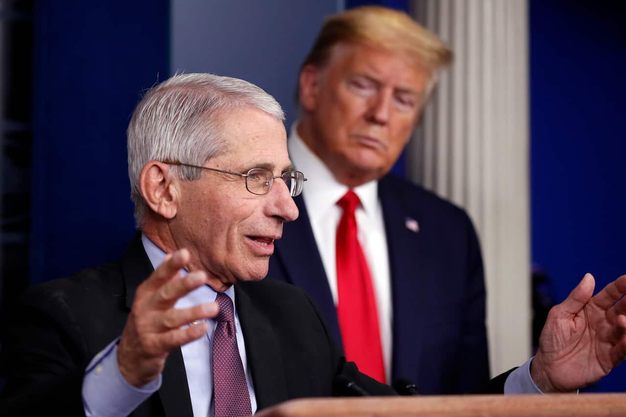 President Donald Trump watches as Dr. Anthony Fauci, director of the National Institute of Allergy and Infectious Diseases, speaks about the COVID-19 outbreak.