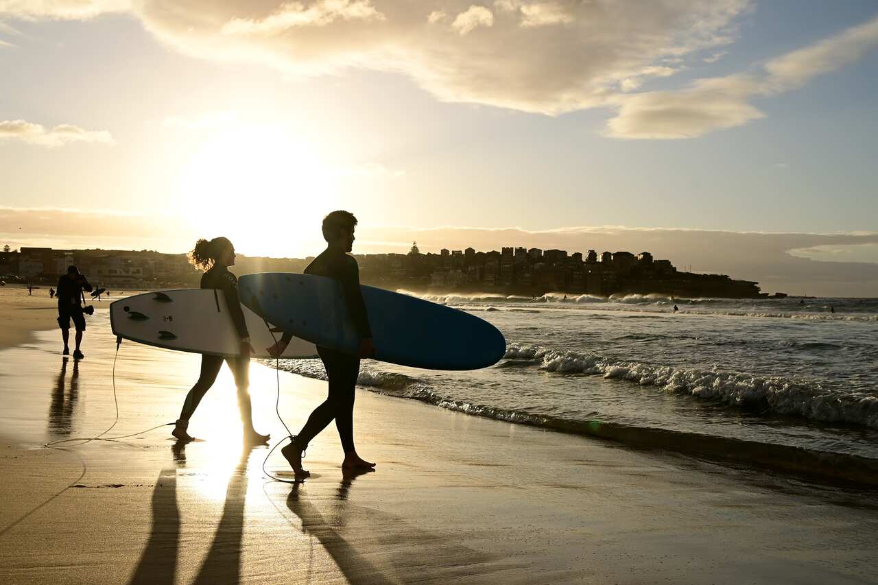Surfers return to the water as Bondi Beach reopens to the public.