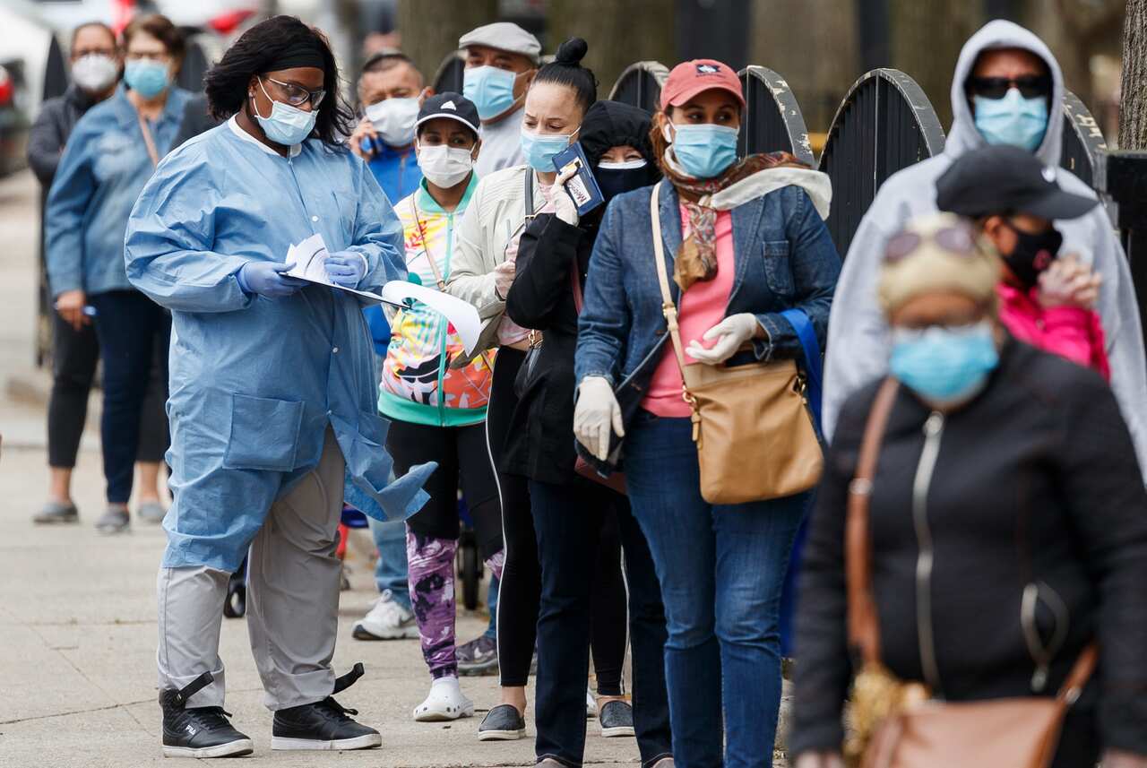 People waiting in line at a newly opened COVID-19 community testing location in New York.