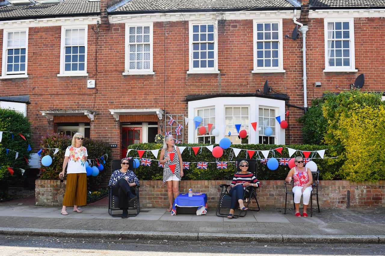 People in Wandsworth take to their front gardens to celebrate a socially distanced street party on the 75th Anniversary of VE Day.