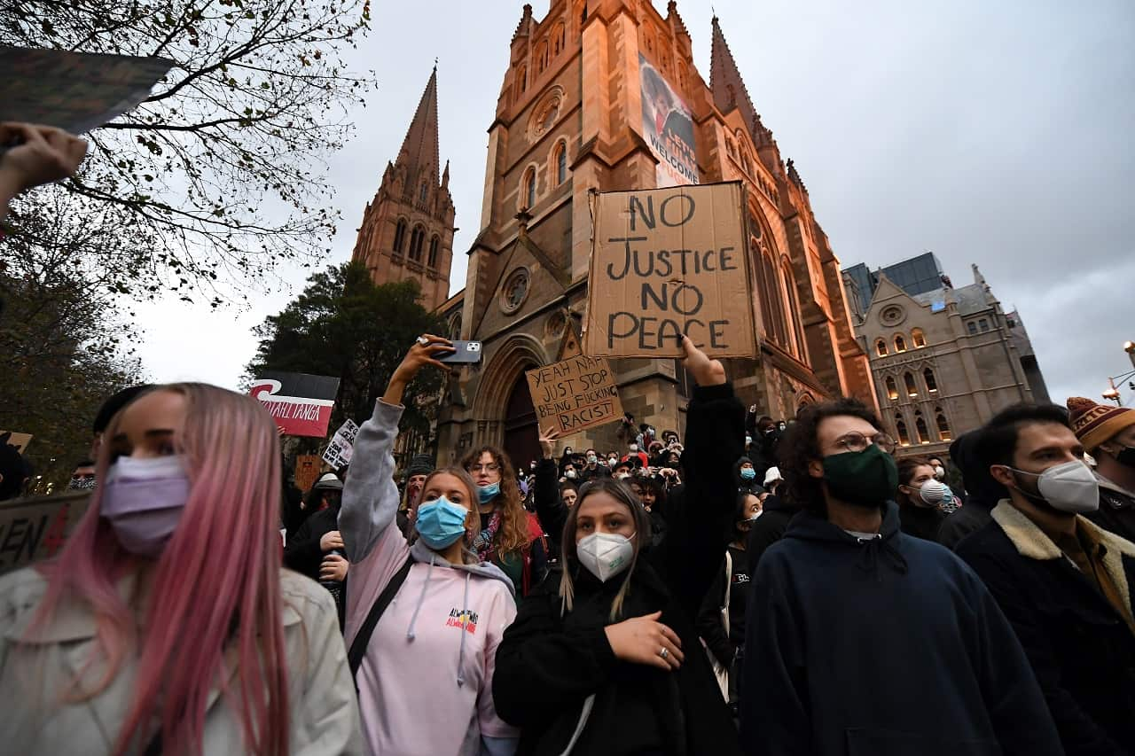 Protesters are seen during a Black Lives Matter rally in Melbourne on 6 June.