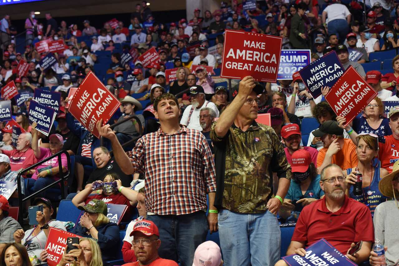 Supporters of US President Donald Trump hold placards during a rally in Tulsa, Oklahoma.