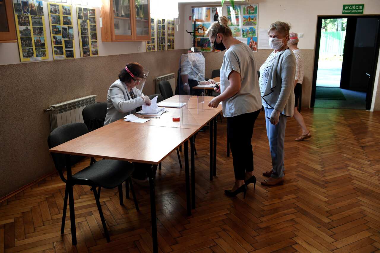 People vote during the presidential election at a polling station in Krasiczyn, Poland.