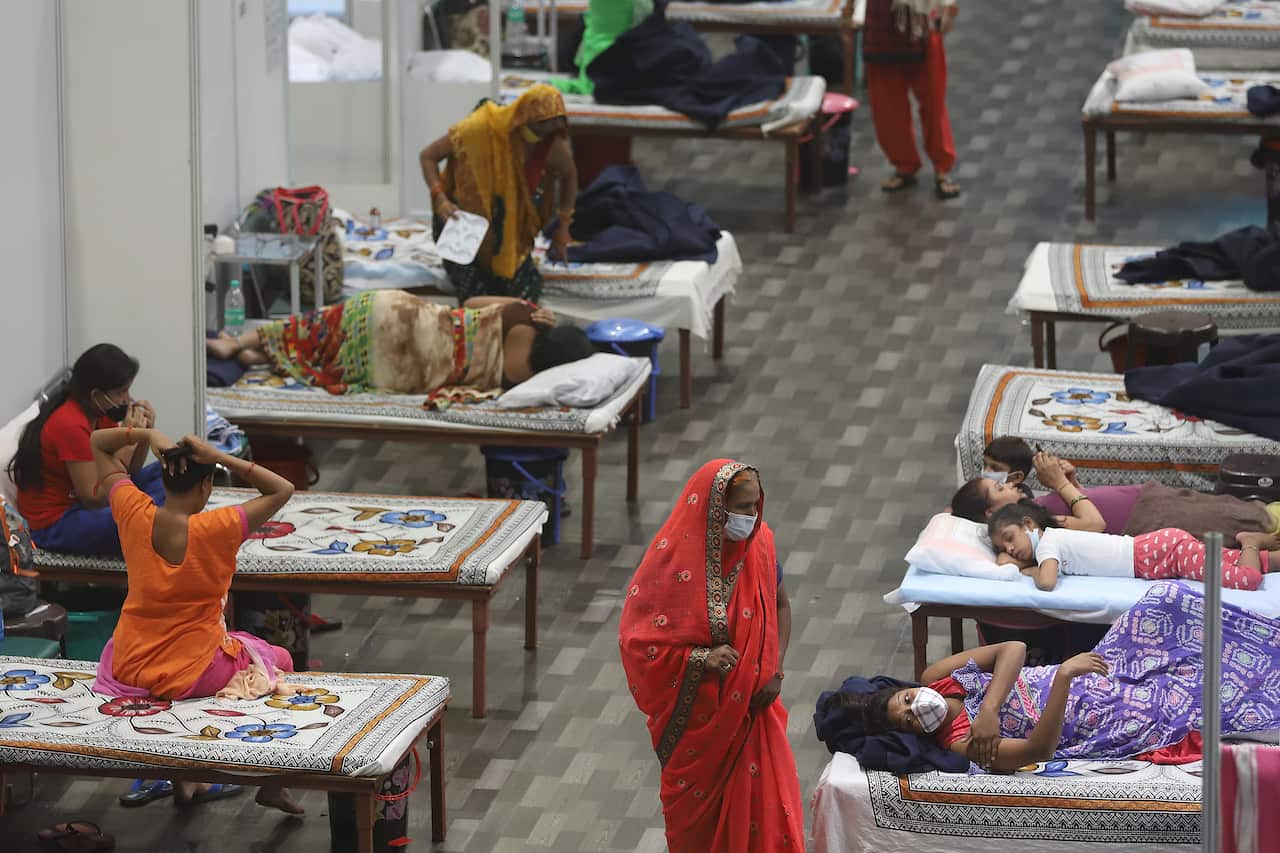 COVID-19 patients are seen inside the Commonwealth Games Village Sports Complex which was temporarily converted into a coronavirus care centre in New Delhi.