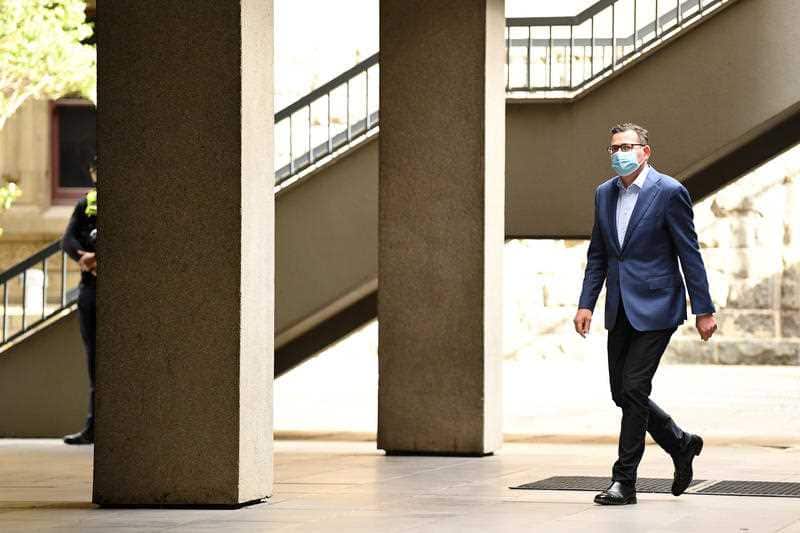 Victorian Premier Daniel Andrews leaving his press conference in Melbourne earlier today.