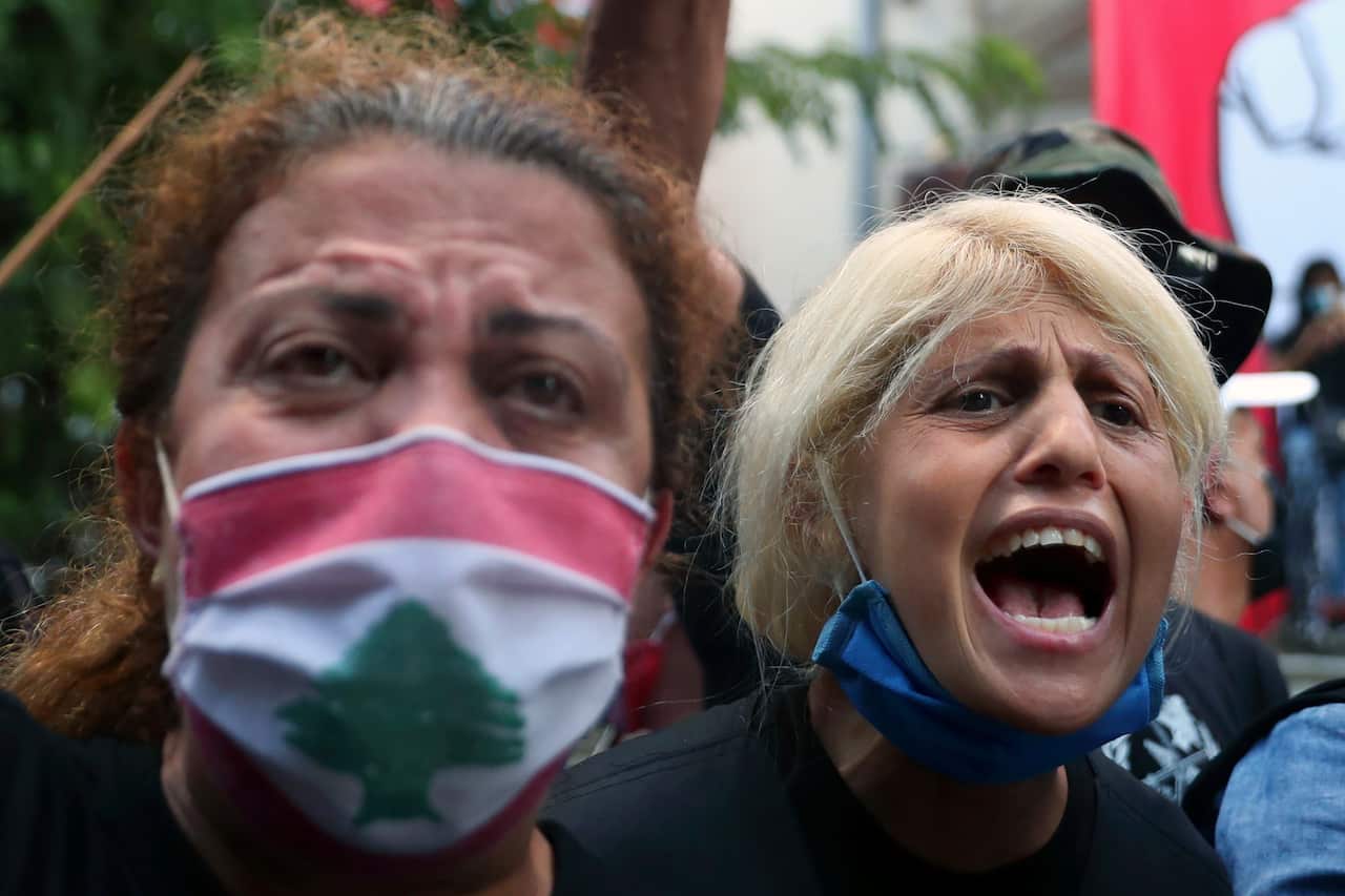 Anti-government protesters chant slogans inside the Lebanese foreign ministry in Beirut, Lebanon.