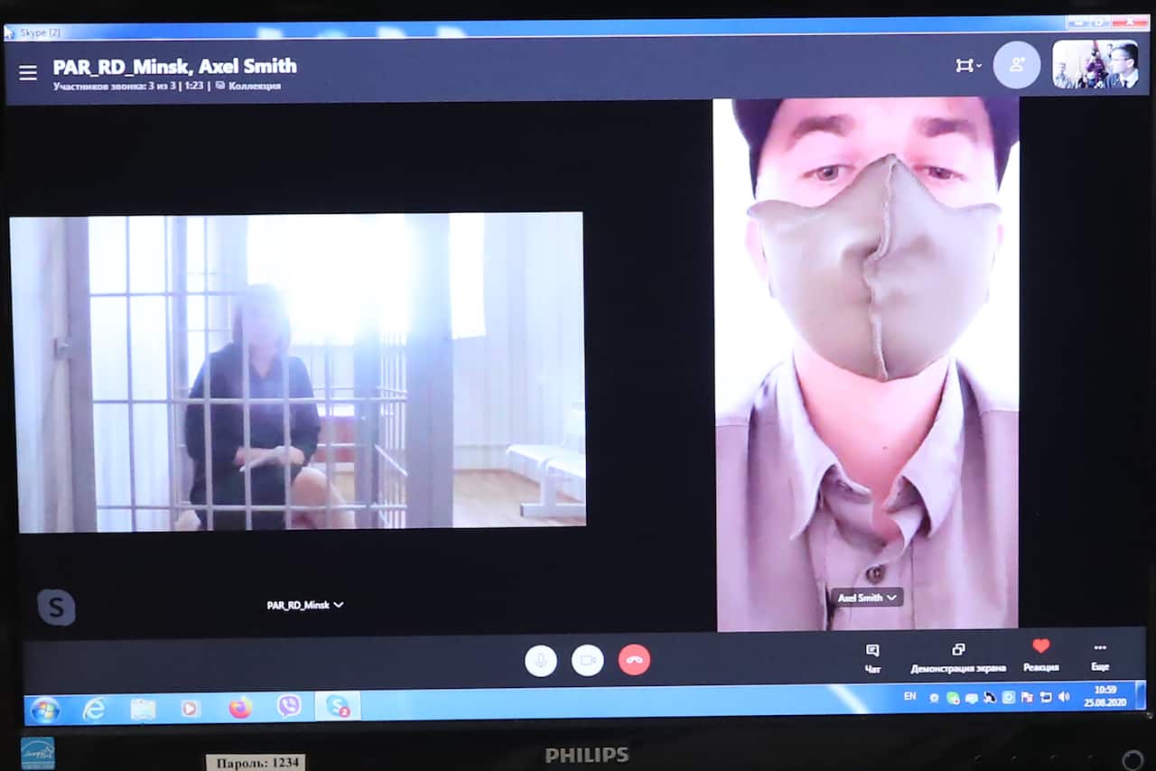 Olga Kovalkova (left on the screen), accused of organising unauthorised mass events, during an online hearing of Minsk's District Court.