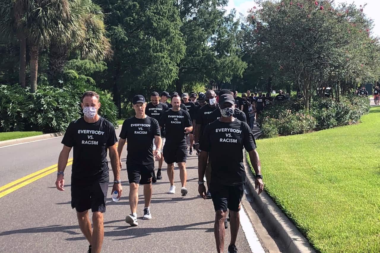 NBA referees march in support of players seeking an end to racial injustice in Lake Buena Vista,