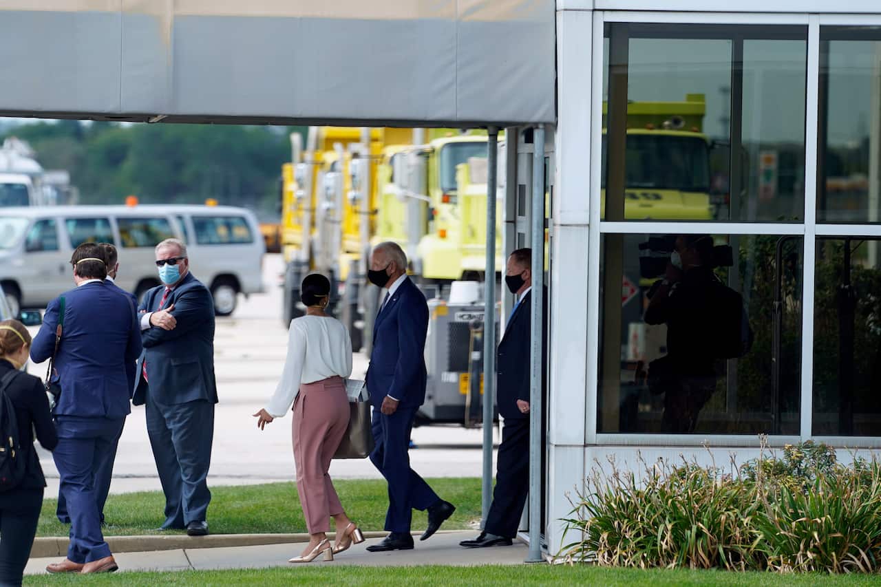 Joe Biden exits a building after meeting with relatives of Jacob Blake at General Mitchell International Airport in Milwaukee.