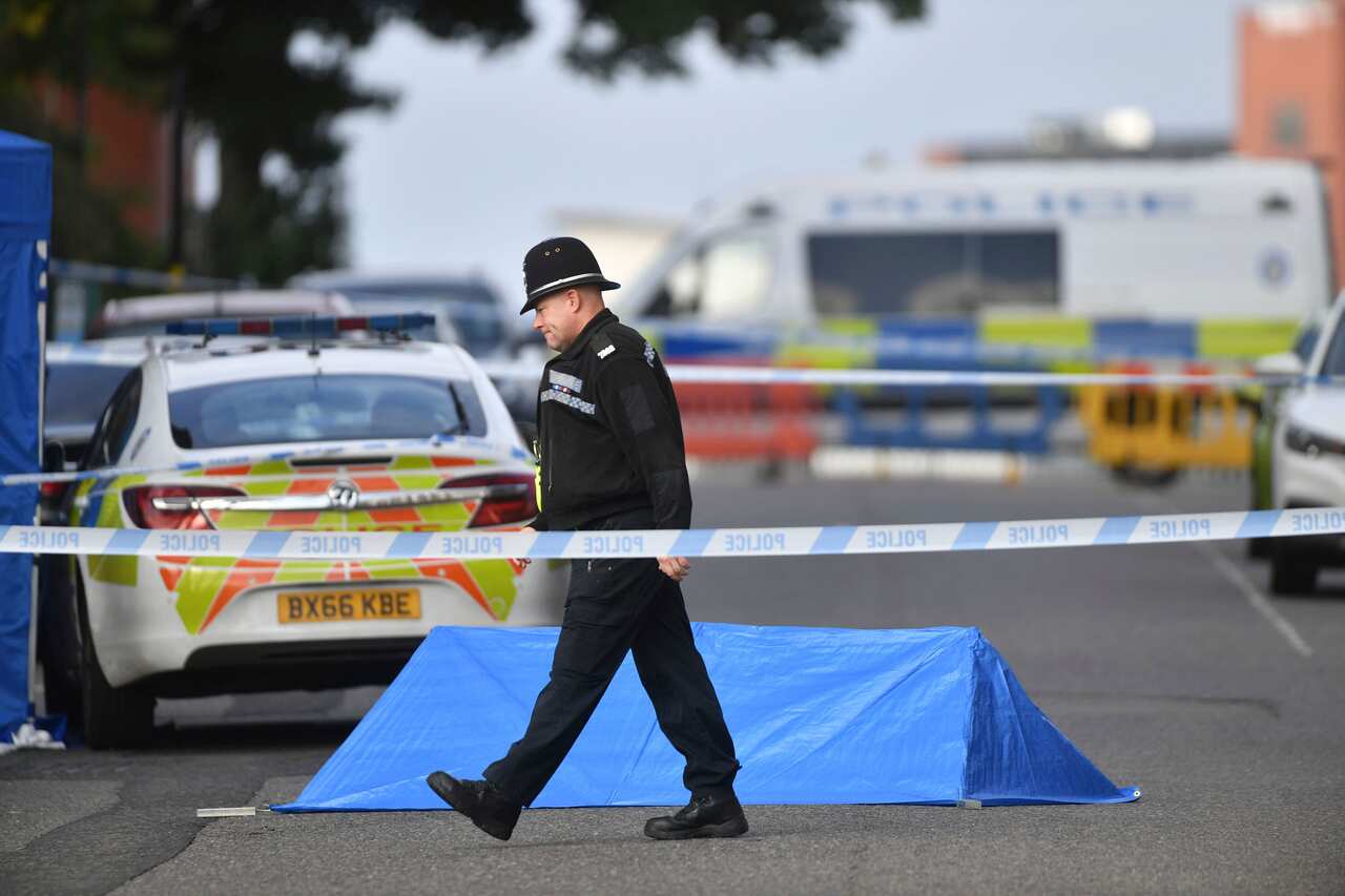 A police officer at a cordon in Irving Street in Birmingham after a number of people were stabbed in the city centre. 