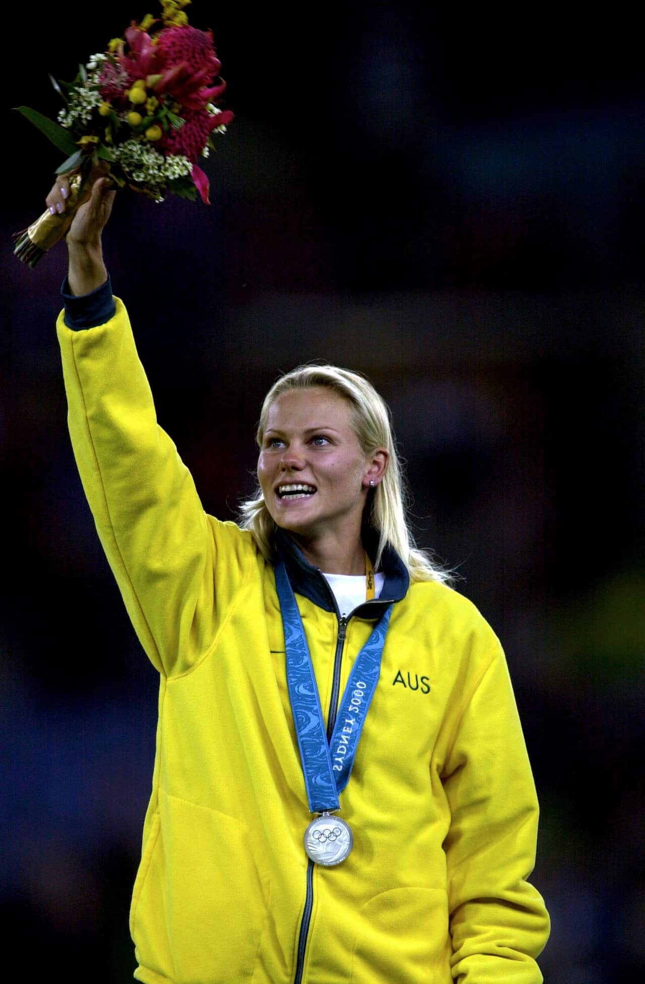 Grigorieva salutes the crowd after receiving her silver medal. 