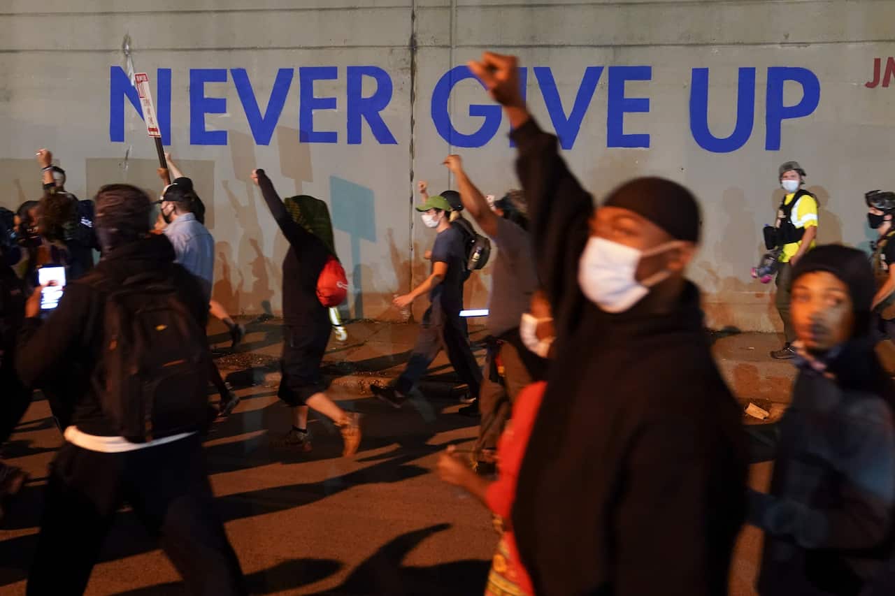 Protesters march in Kentucky's largest city on Thursday, September 24.