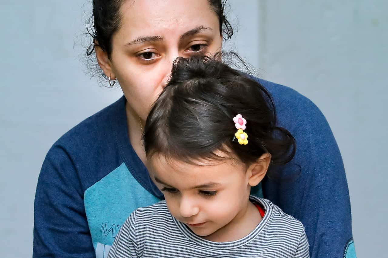 A woman with her child sit in a bomb shelter to protect against shelling in Stepanakert, the self-proclaimed Republic of Nagorno-Karabakh, Azerbaijan. 