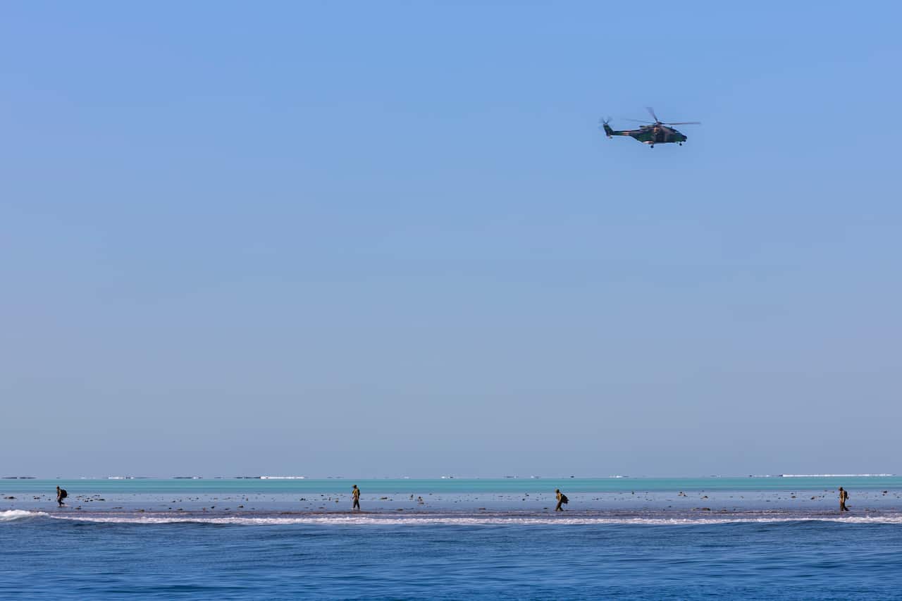 Australian Clearance Diving Team One search the unexploded ordnance in the vicinity of Elizabeth Reef.
