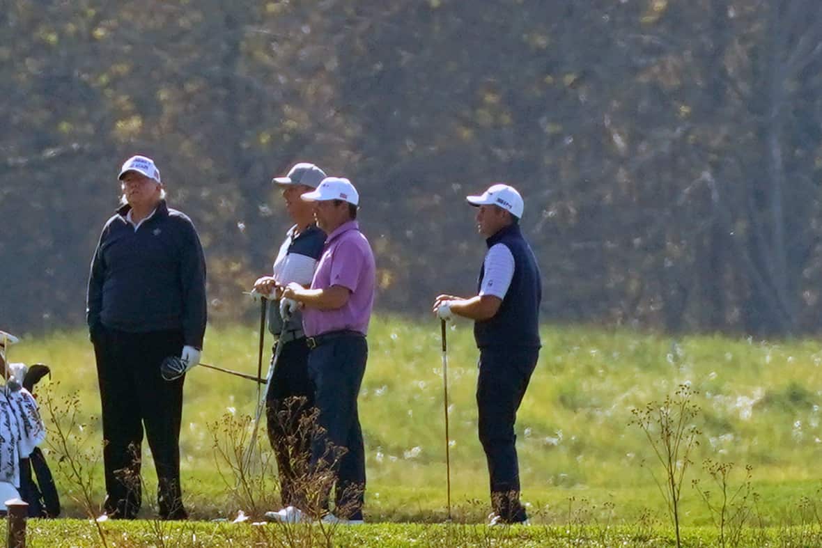 US President Donald Trump (left) was golfing when Joe Biden's victory was declared.