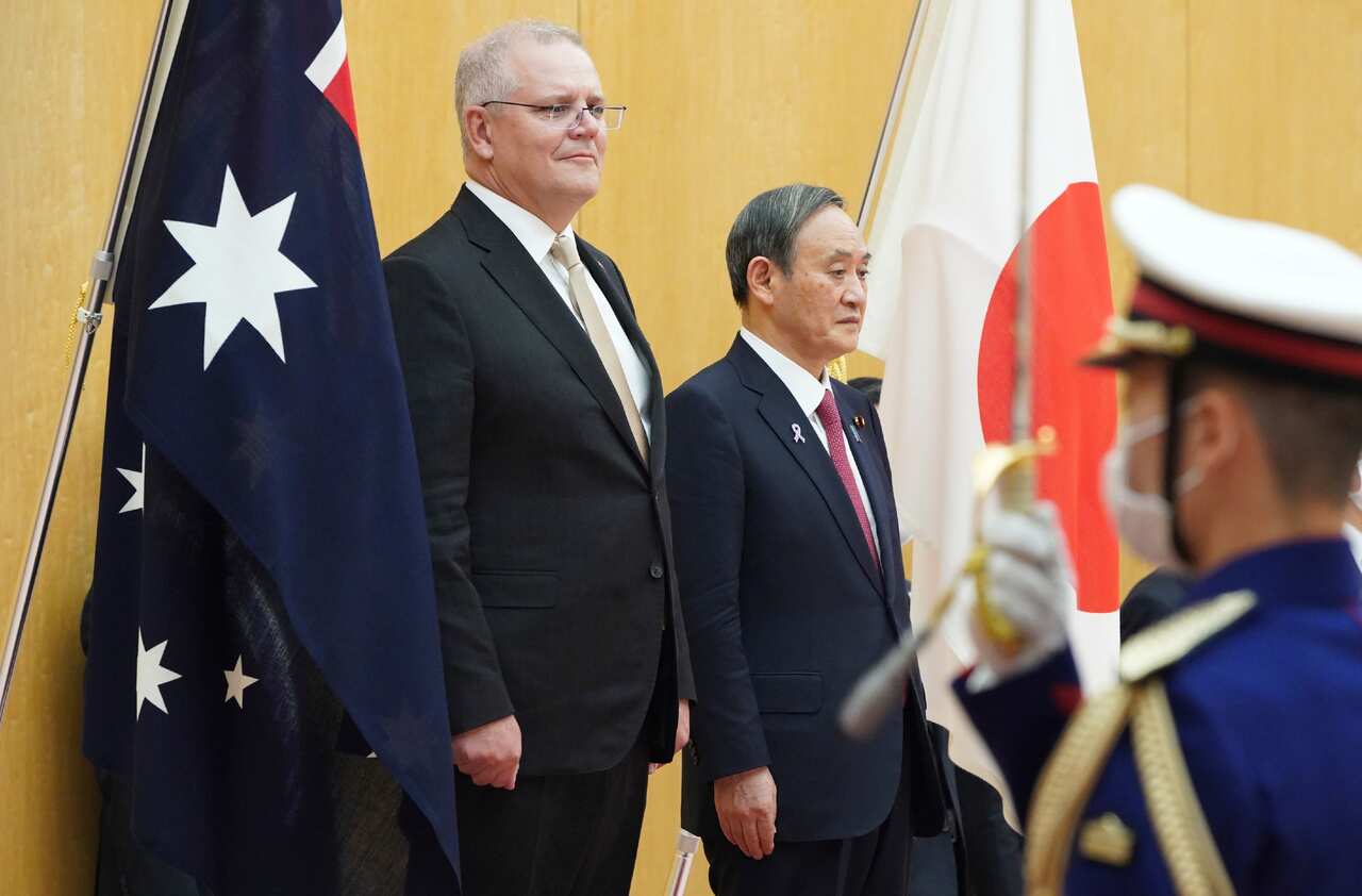 Japan's Prime Minister Yoshihide Suga (R) and Australian Prime Minister Scott John Morrison receive honor guard at Prime Minister's office in Tokyo on ov. 17, 2020. ( The Yomiuri Shimbun via AP Images )