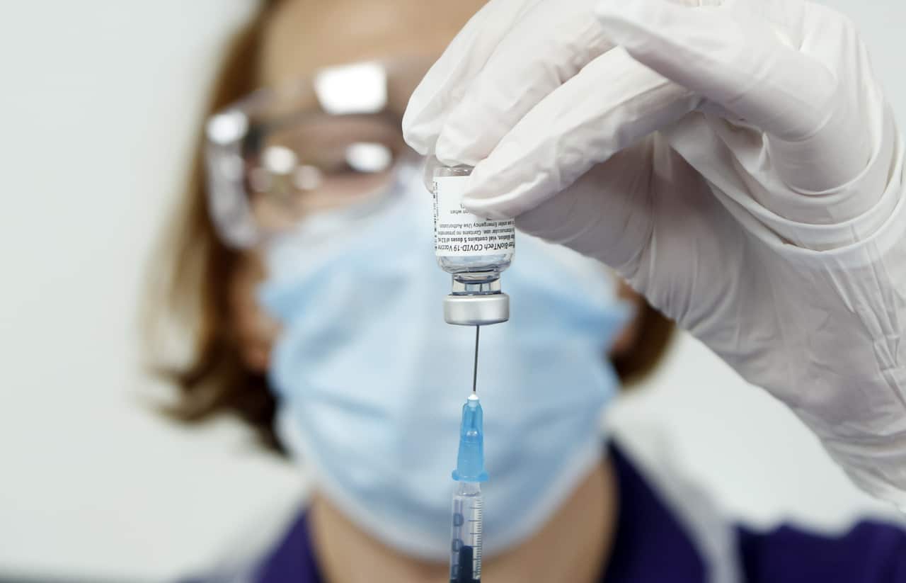 Nurse Pat Sugden prepares the Pfizer-BioNTech vaccine at the Thackray Museum of Medicine in Leeds.