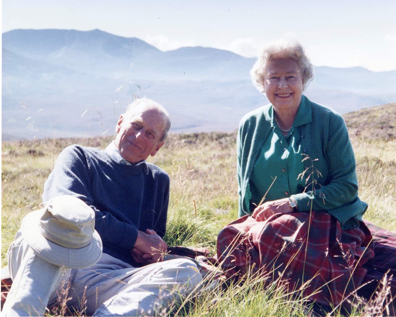 Buckingham Palace released a personal photograph of Queen Elizabeth II and Prince Philip Duke of Edinburgh at the top of the Coyles of Muick, Scotland in 2003.