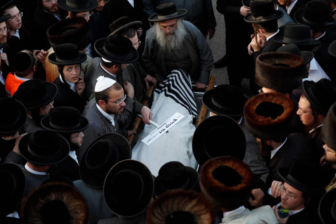 Israeli ultra-Orthodox mourners attend a funeral of a man who died in the stampede