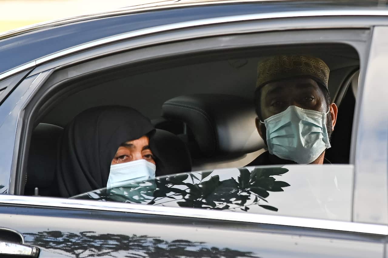 The parents of Ayaz Younus watch from a car as he is buried at the Riverstone Cemetery at Marsden Park, NSW, Wednesday, May 5, 2021. Pakistani national Ayaz Younus, died in floodwaters in Glenorie NSW in March. (AAP Image/Steven Saphore) NO ARCHIVING