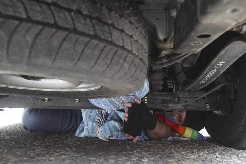 The protester who climbed under the van to stop it from moving