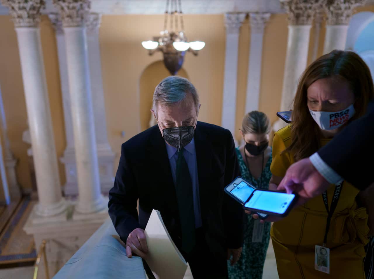 Reporters question Senate Majority Whip Dick Durbin at the Capitol in Washington, 7 October, 2021.