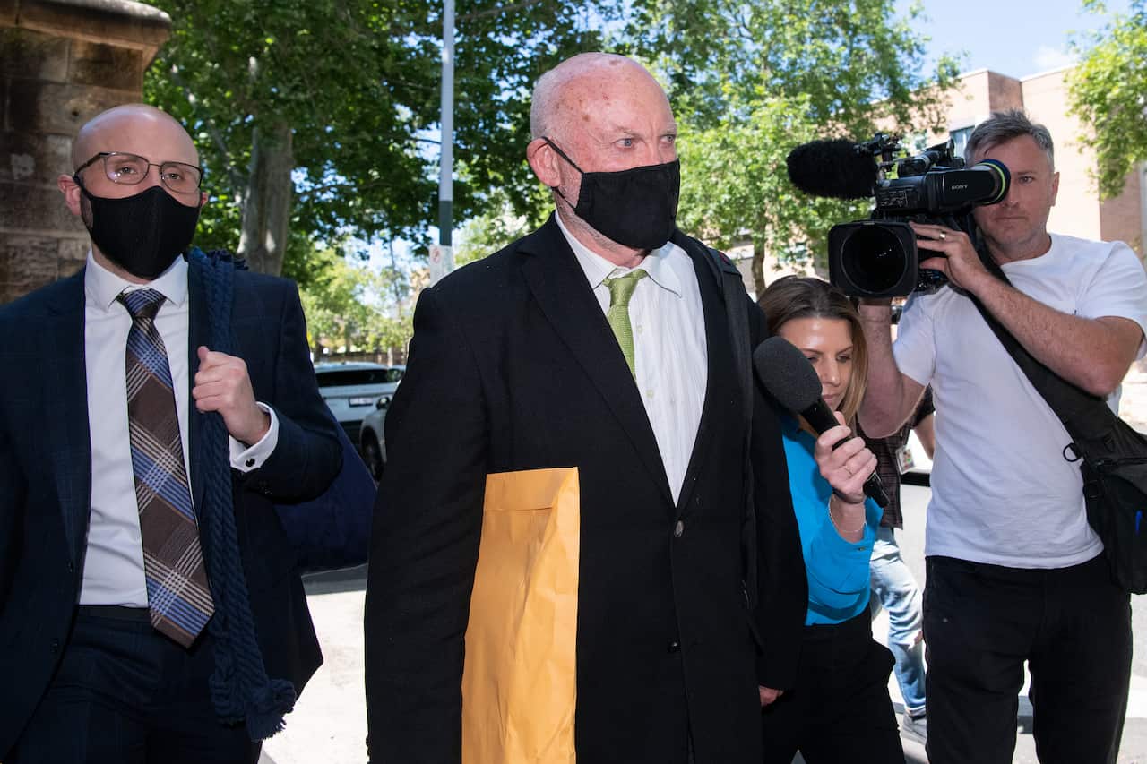 Former NSW Labor minister Ian Macdonald (centre) arrives at the NSW Supreme Court in Sydney.