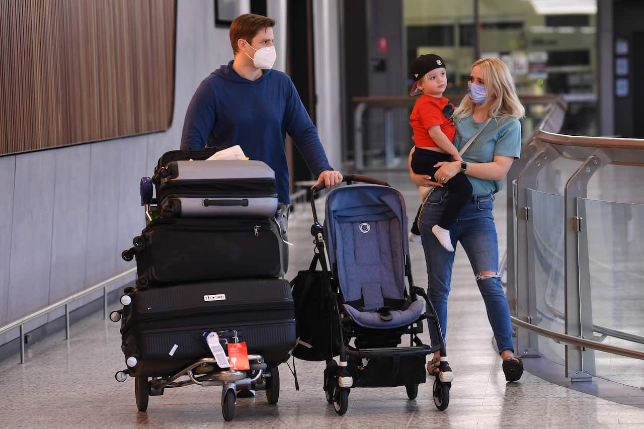 A family is reunited in international arrivals terminal at Tullamarine Airport in Melbourne, Monday, November 1, 2021.