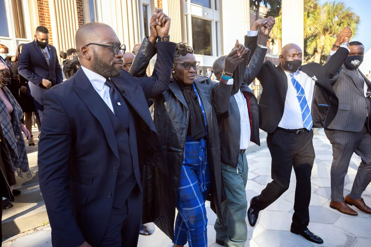 Ahmaud Arbery's mother Wanda Cooper-Jones, second left, and supporters, outside court after her son's murderers were jailed for life on 7 January, 2022.