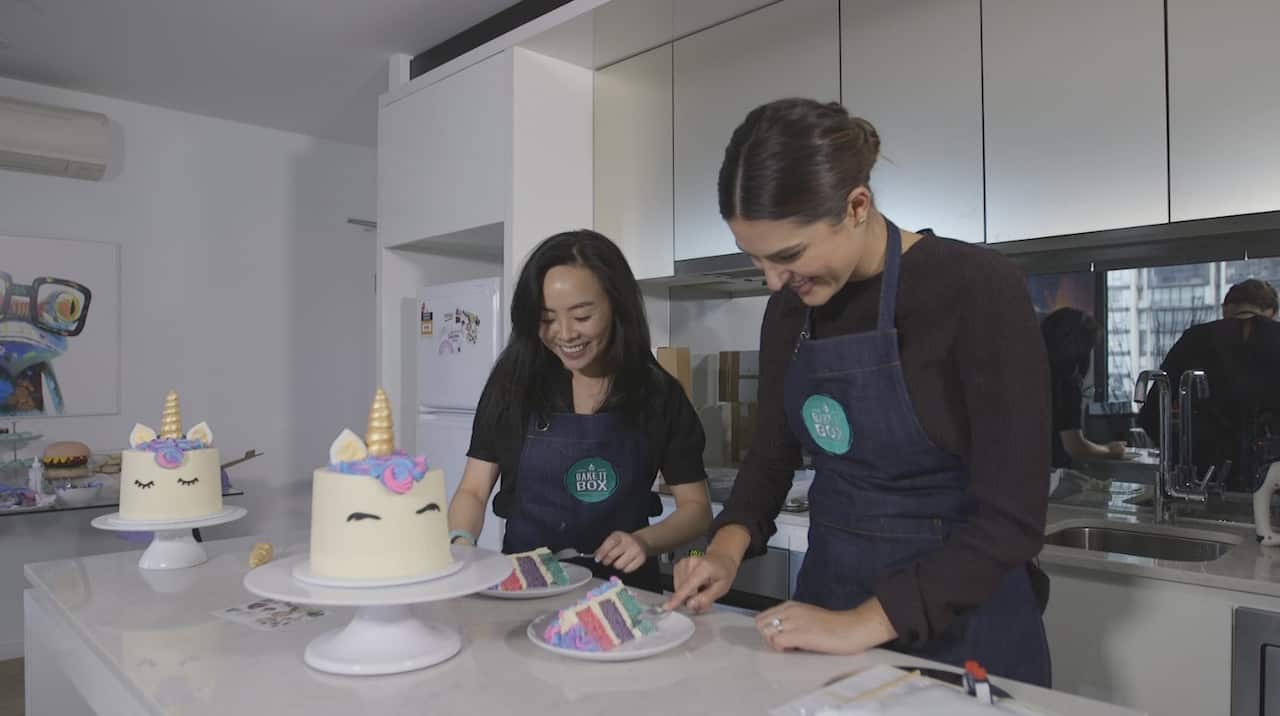 reporter, Sarah Abo and Bake It Box Founder, Emily Chen taste their creations.