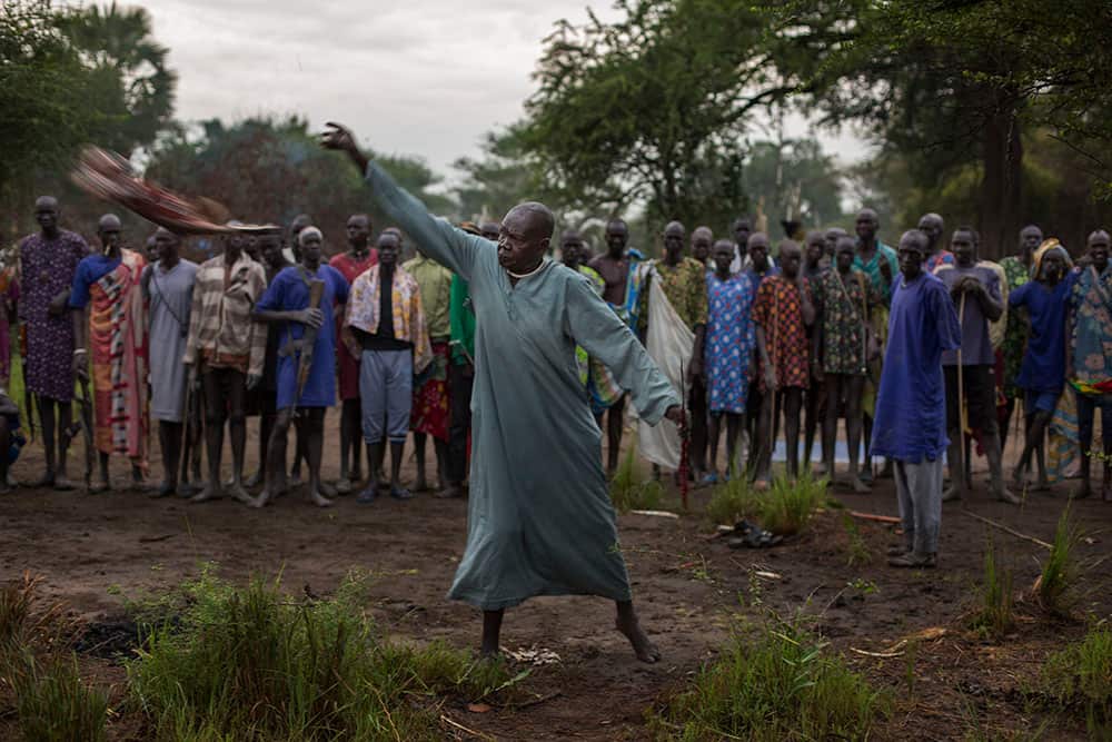 The tribal leader performs a goat sacrifice in an attempt to stop cattle raiding and revenge attacks. As wedding dowries increase, clans are forced to steal each others' livestock, and if necessary, kill whoever stands in their way. (Matthew Abbott)
