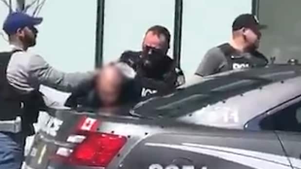 The suspected driver of a van that allegedly killed pedestrians in Toronto being arrested by police.
