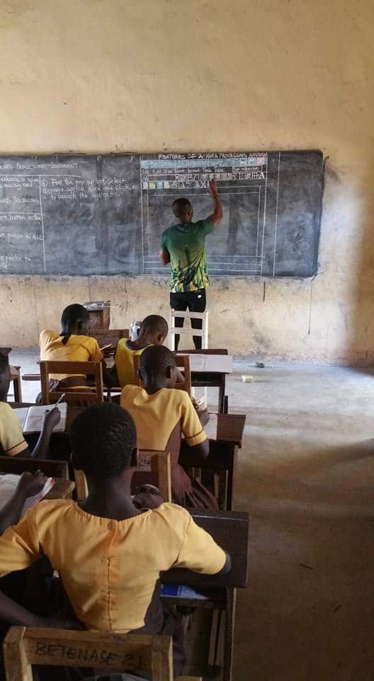 Kwadwo teaches Microsoft word using a blackboard.