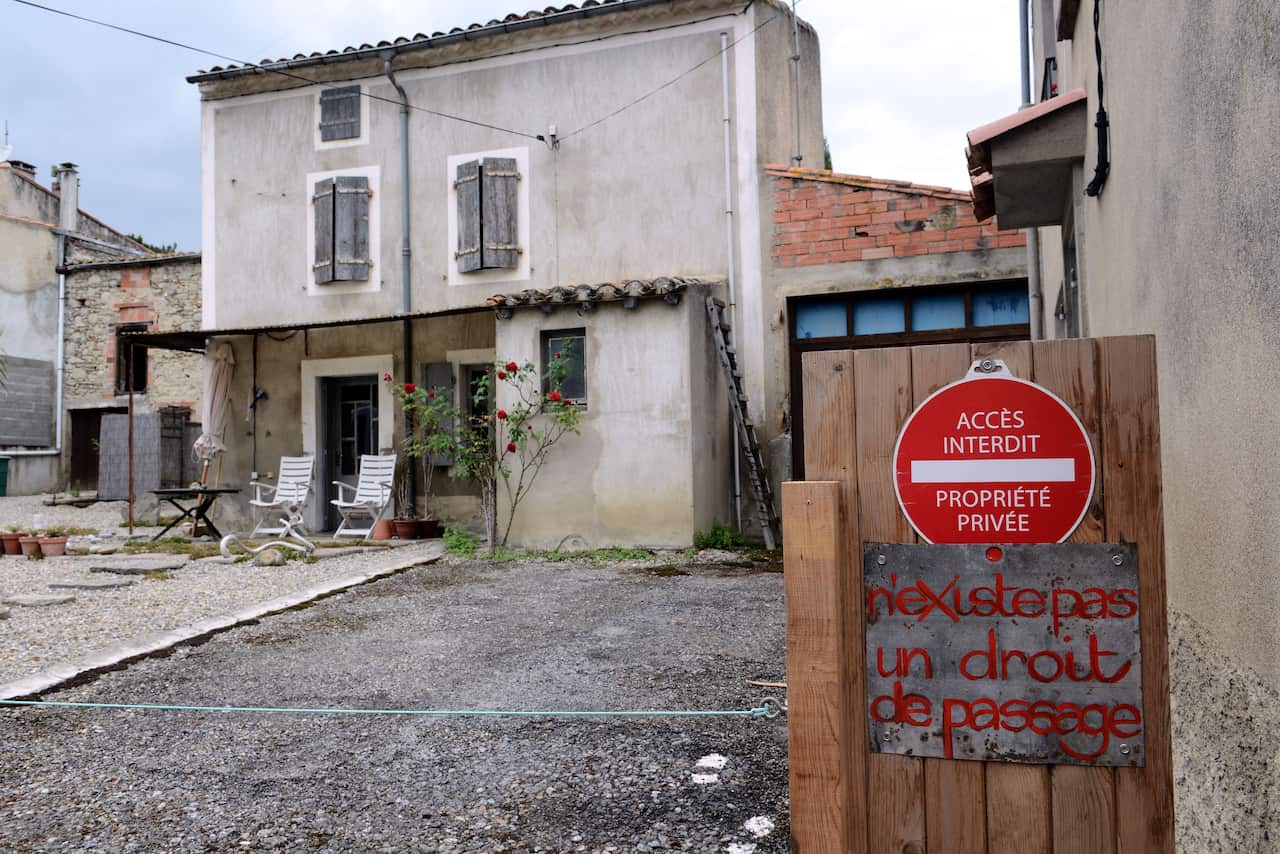 This photo shows the house of British citizens Krystina and Robert James Dunlop in Brugairolles, France, August 19, 2014. The inscription reads 'No right of way'. (AFP)