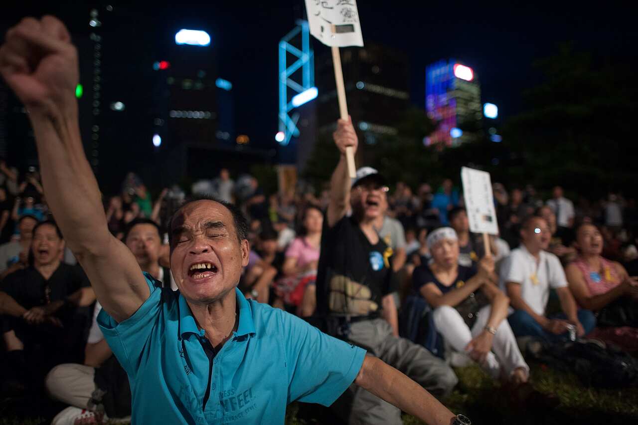 rotesters take part in a rally during the Ocuppy Central with Love and Peace protest at Tamar Park outside of the Hong Kong Government Building on August 31, 2014 