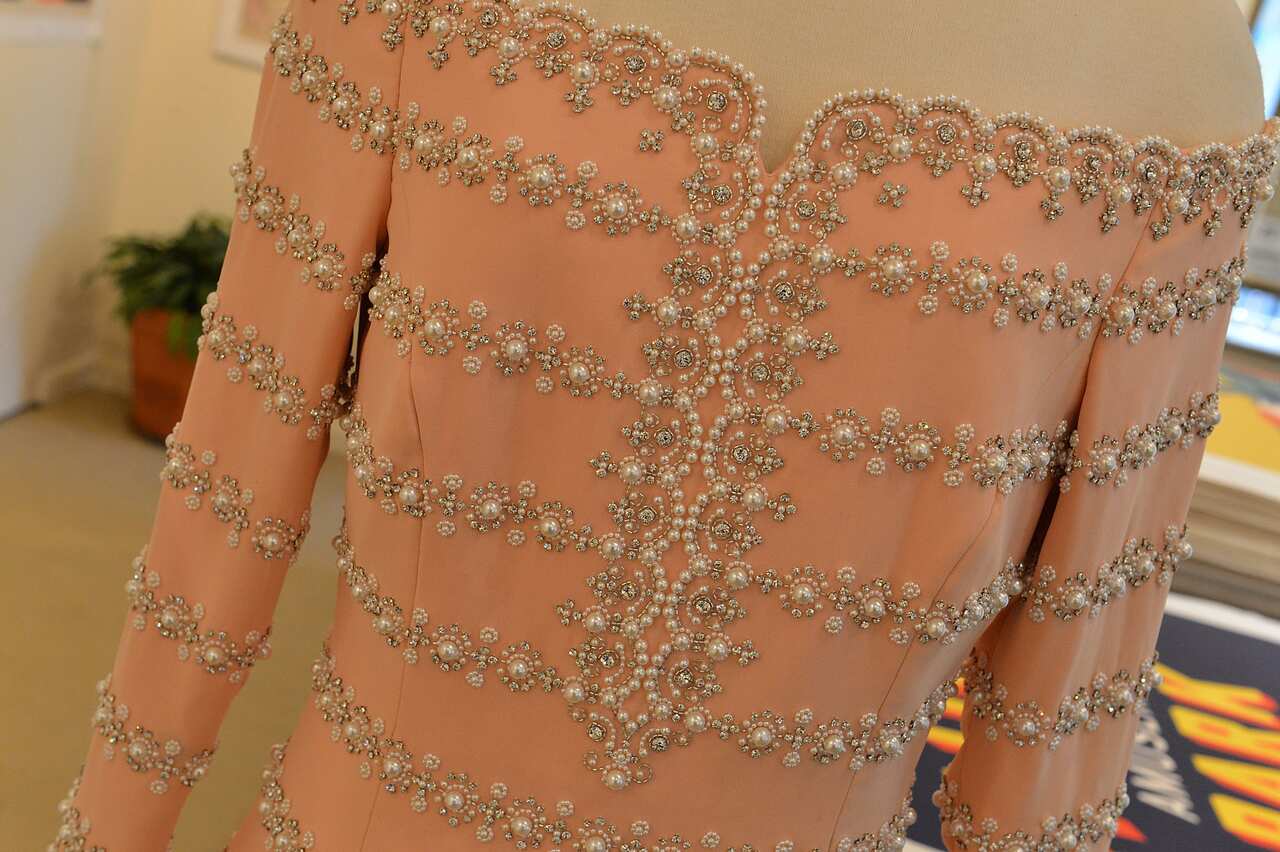 A petal pink silk Catherine Walker gown double worn by HRH Princess Diana to the reopening of the Savoy theatre and to a performance of La boheme at the London Coliseum in 1993 (Getty)