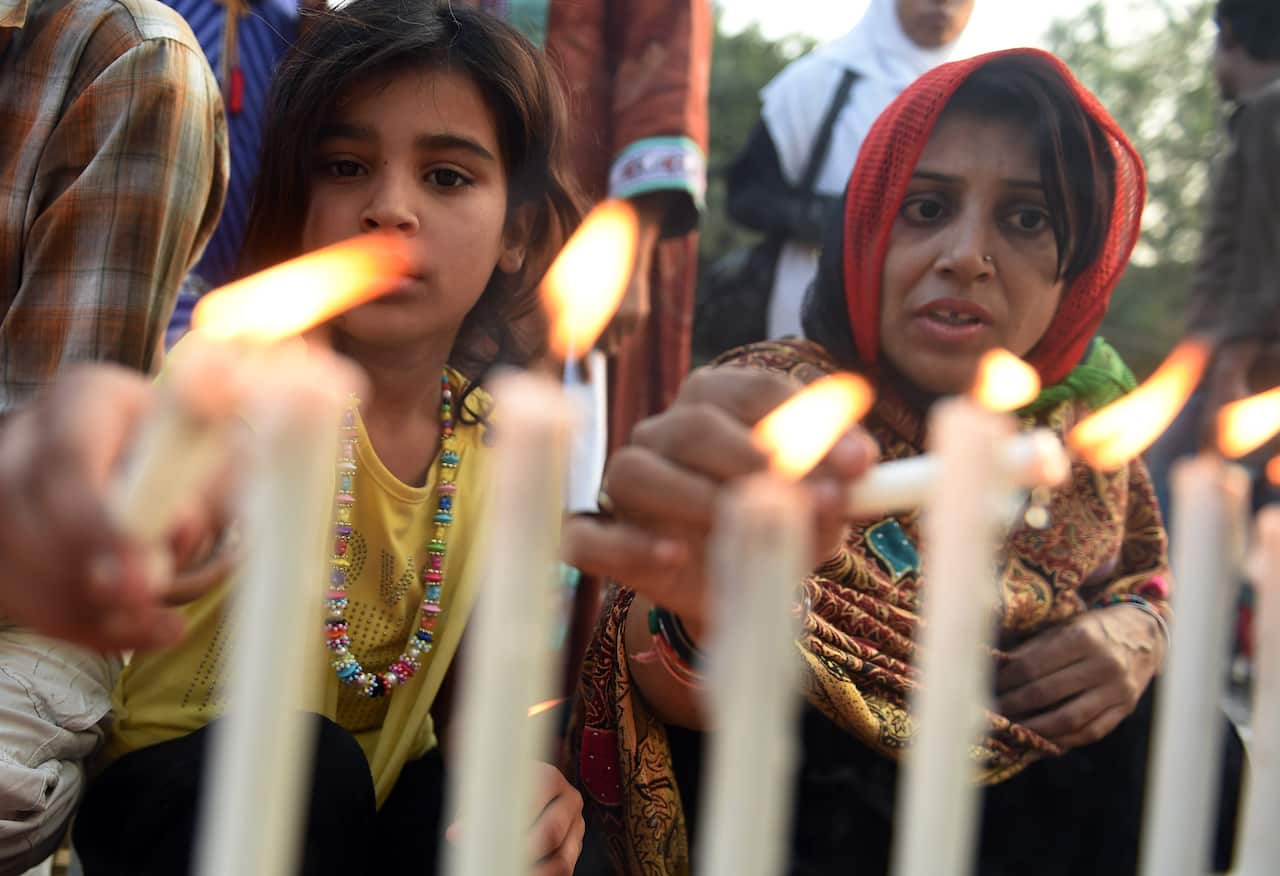 Pakistani civil society activists light candles during a rally in Karachi on December 23, 2014, held in solidarity with the victims of the Peshawar school massacre. (Getty)