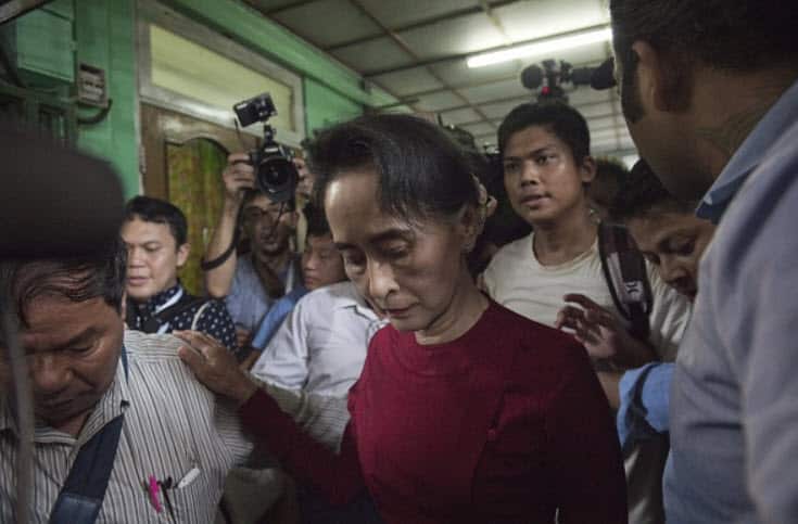 Myanmar opposition leader and head of the National League for Democracy (NLD) Aung San Suu Kyi leaves a polling station after casting her vote in Yangon on November 8, 2015. The historic poll could see Suu Kyi's opposition launched to power after decades 