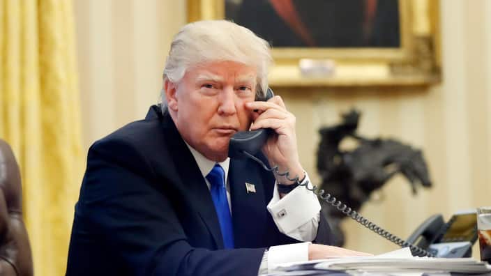 U.S. President Donald Trump speaks on the phone with Prime Minister of Australia Malcolm Turnbull in the Oval Office of the White House in Washington.