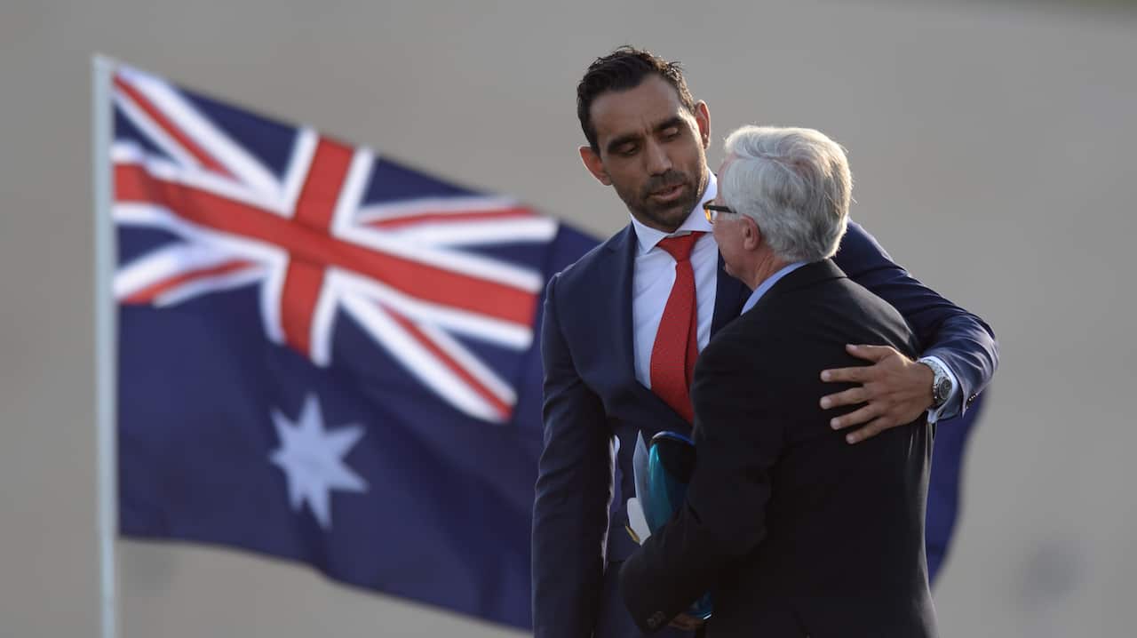 Australian of the Year 2014 Adam Goodes (left) hugs Fred Chaney, Senior Australian of the Year - AAP-1.jpg