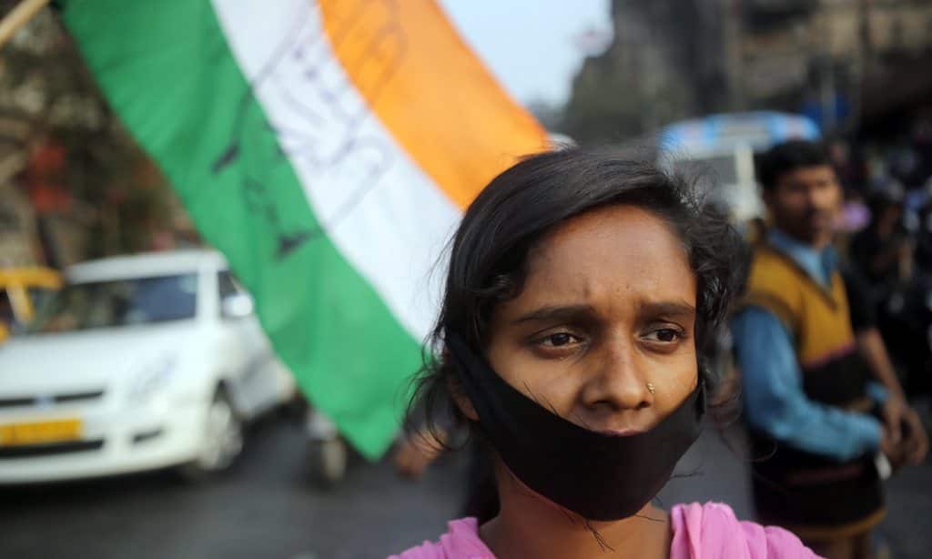 National Congress activists make a human chain as they block the Esplaned crossing during a protest demonstration against Bengal Government with a issue of rape case in Calcutta, eastern India on 3 January, 2014.