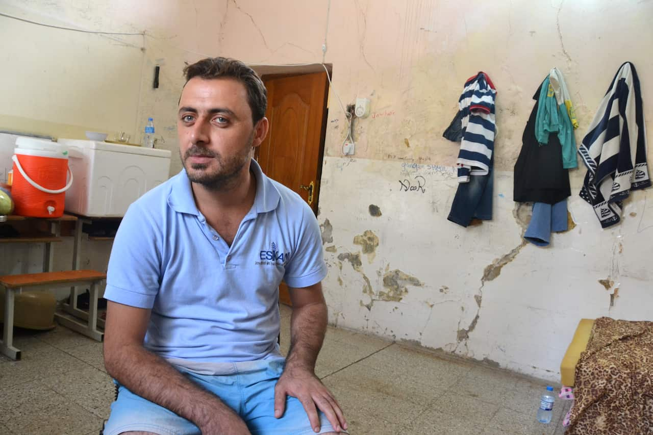 Tofee Alabdal, an Iraqi Christian, in a classroom of the 11 September School in Ankawa, the Christian quarter of Erbil, Iraqi Kurdistan. Mr Alabdal fled Qaraqosh on August 6, the night it was captured by the Islamic State. (Michael Clayfield)