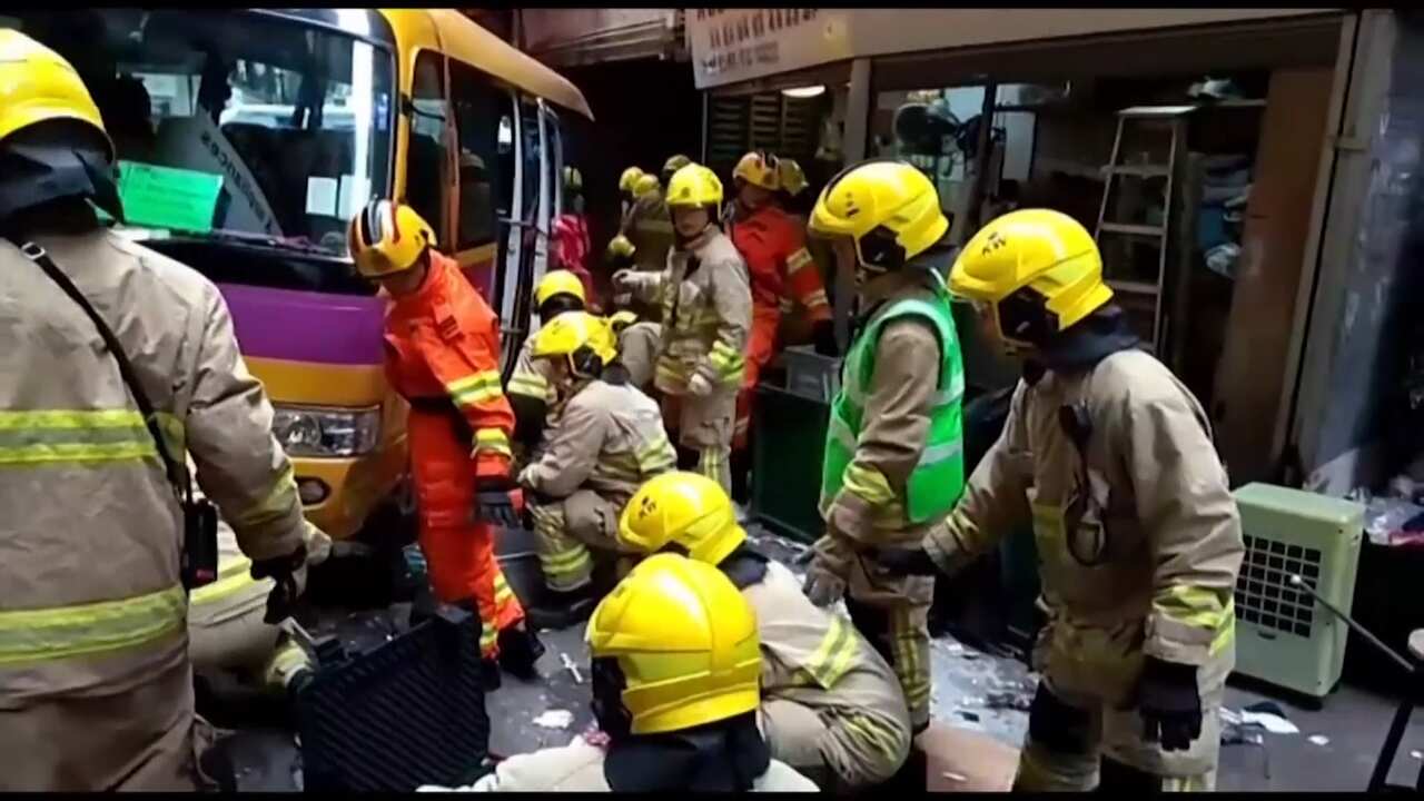 The scene in a Hong Kong neighbourhood after a bus mounted the pavement.