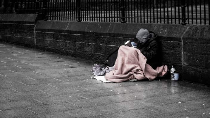 A homeless man sits on the streets. A new Melbourne project is aiming to break the cycle.