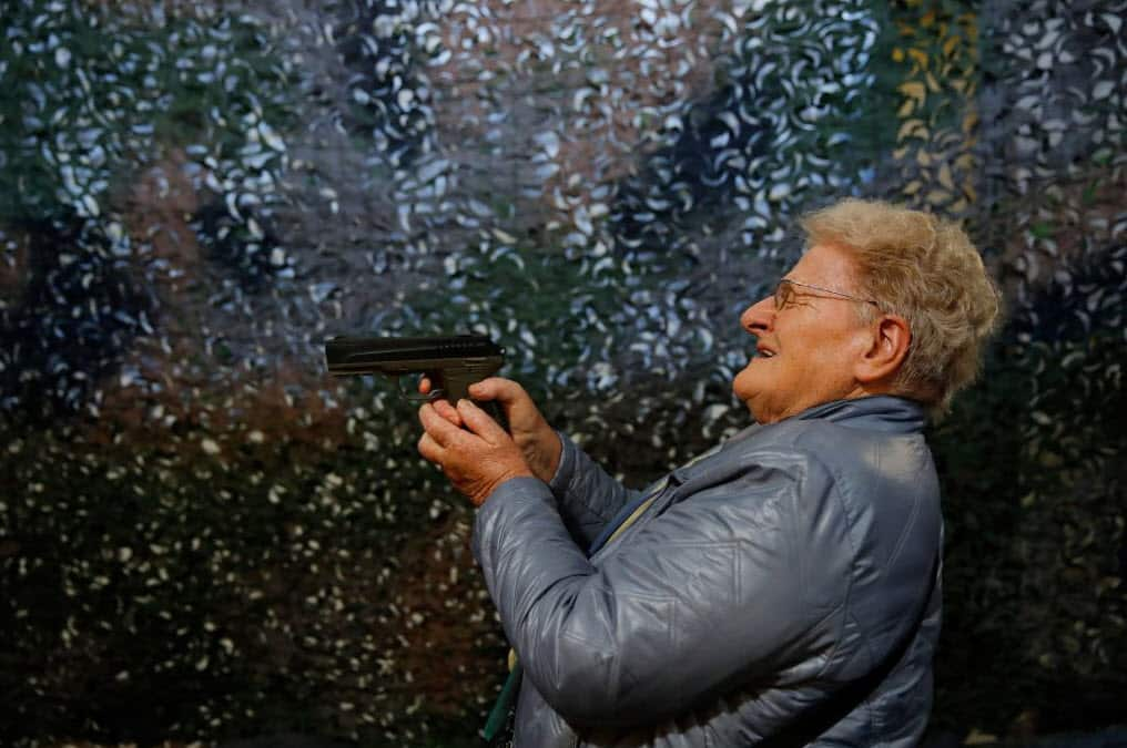 A visitor holds and tries a CO2 handgun during the 45th edition of the Arms Trade Fair, in Lucerne, on March 29, 2019 (Getty Images)