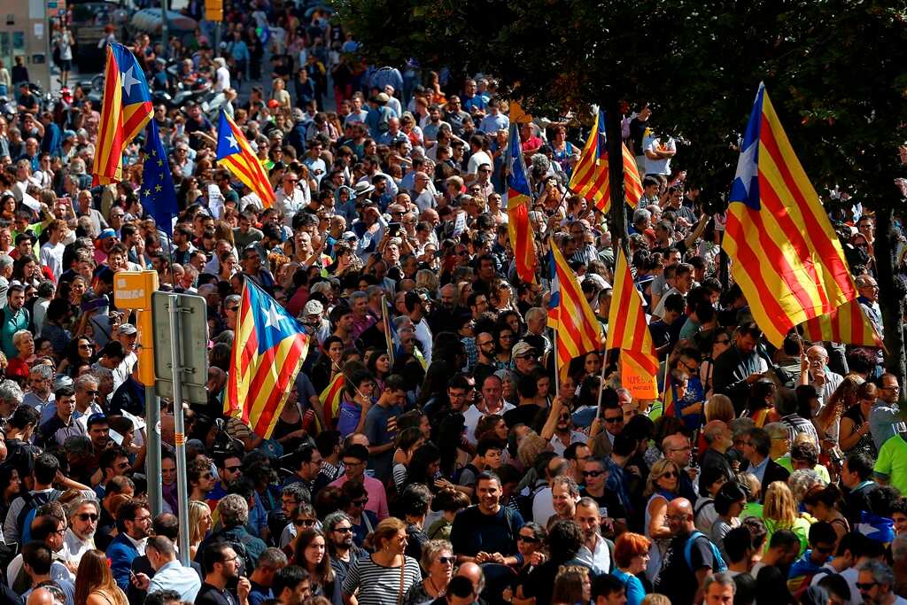 Thousands of people protest against the police searches at Rambla Catalunya, in Barcelona, northeastern Spain