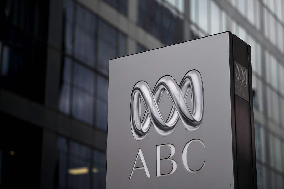 A sign with a logo and the letters "ABC".