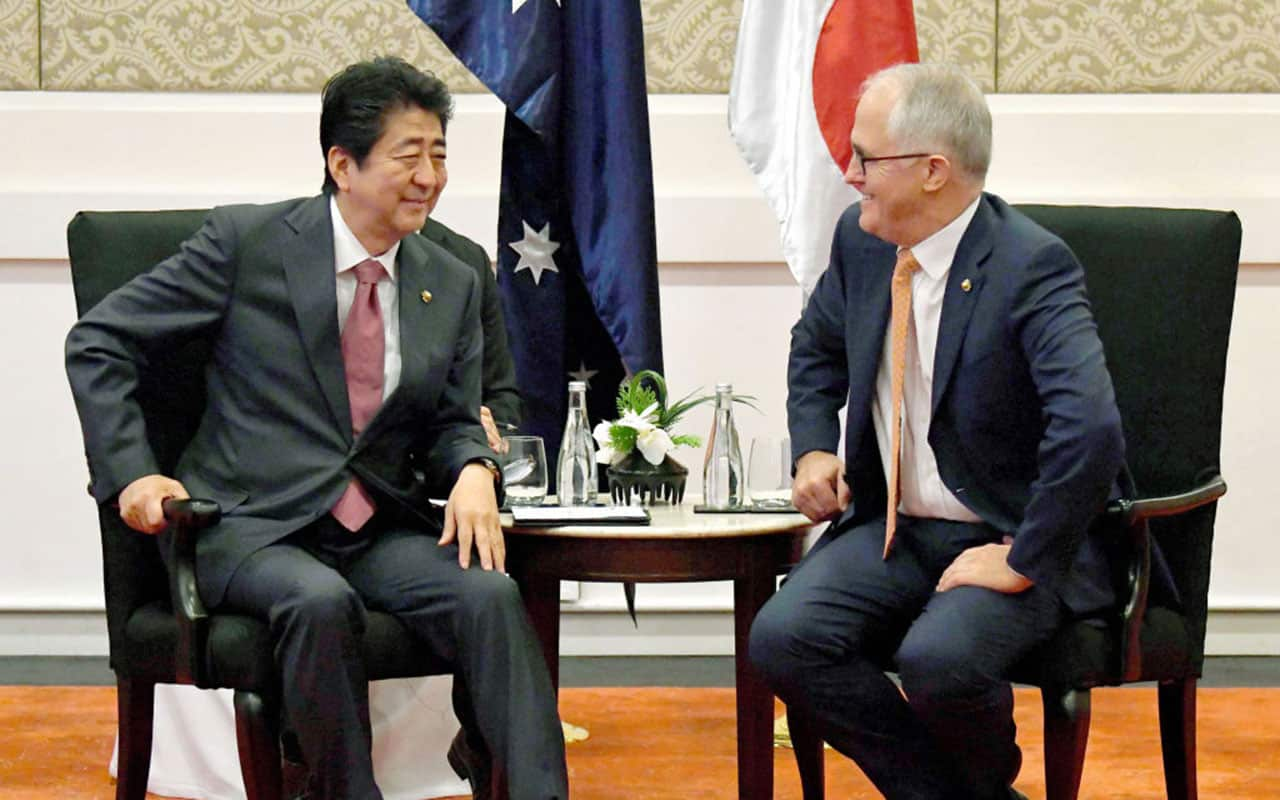 Japanese Prime Minister Shinzo Abe (L) and Australian Prime Minister Malcolm Turnbull (R) talk during their meeting on November 13, 2017 in Manila, Philippines.